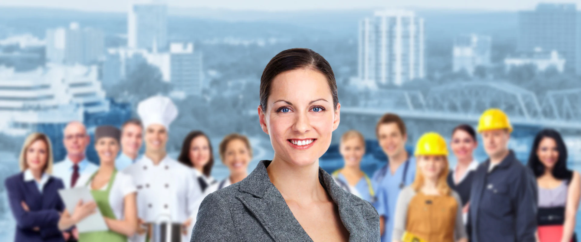 Bildbeschreibung / description: Eine Gruppe, vorrangig mit Berufen in der Industrie, schaut freundlich in die Kamera.